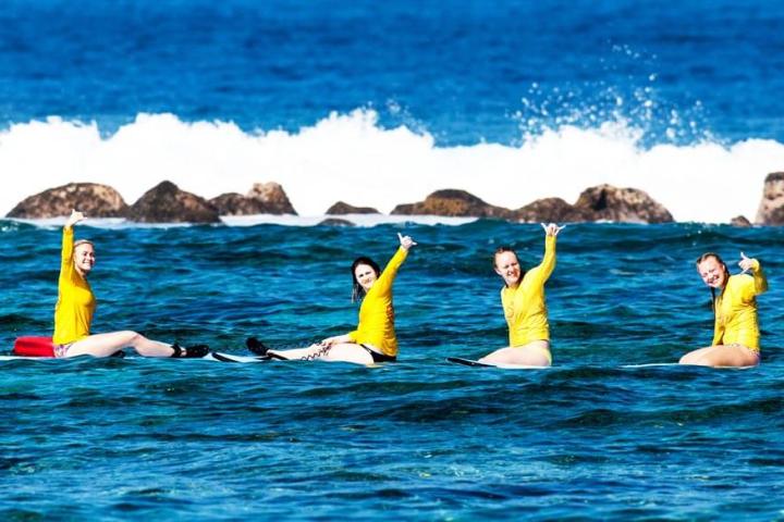 a group of people swimming in a body of water