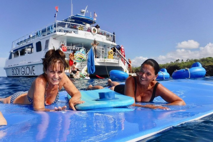 a group of people in a pool of water