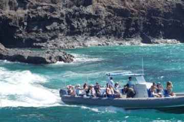 a group of people on a boat in the water