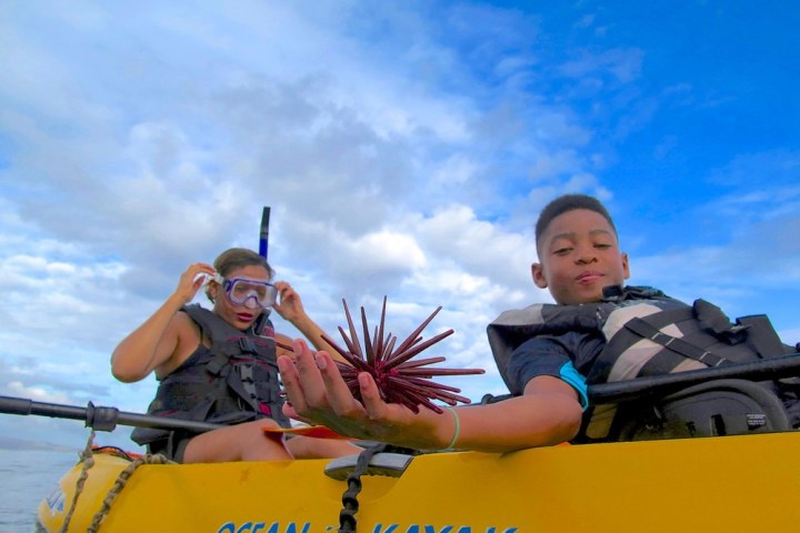 a man riding on the back of a boat