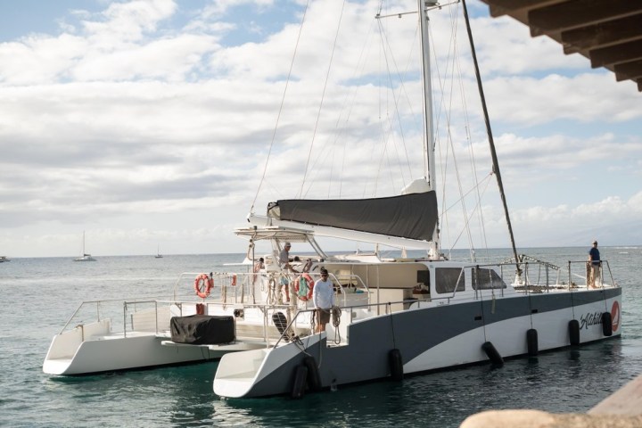 a boat is docked next to a body of water