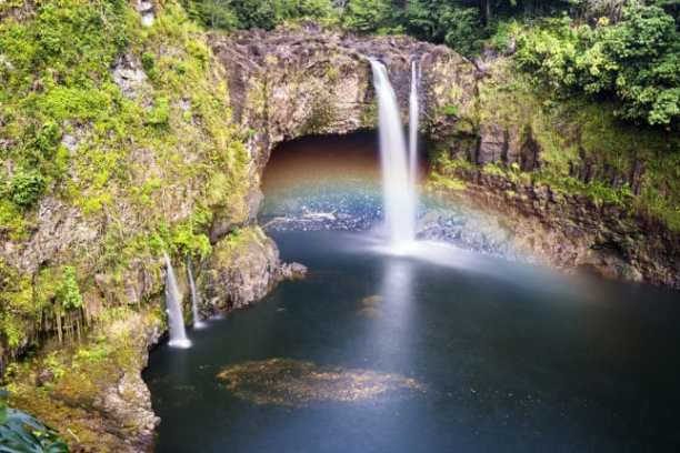 a large waterfall over a river