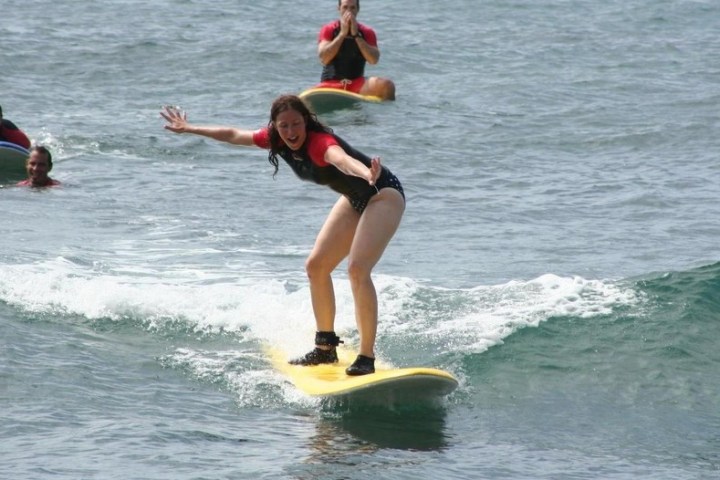 a person riding a wave on a surfboard in the water